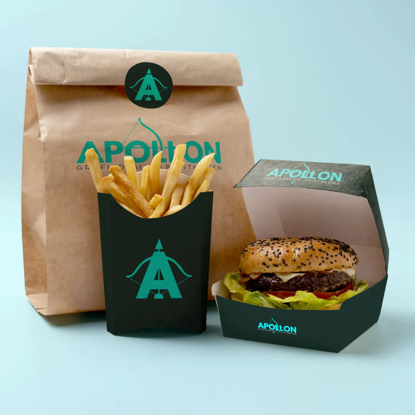 Verpackungen mit Apollon Logo: Papiertüte, Pommes-Box und Burger-Box